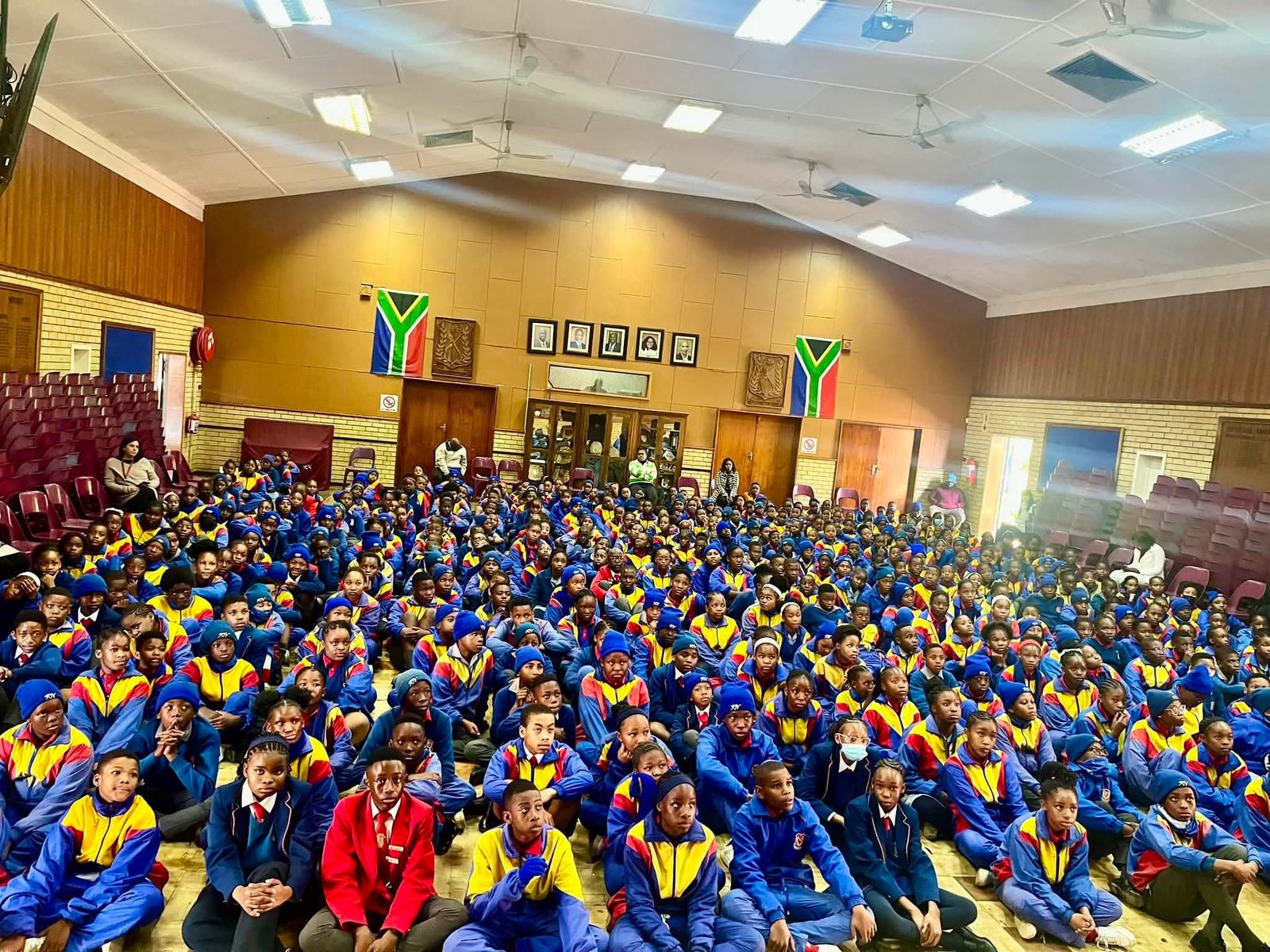 Hundreds of Noord Primary learners in school colours seated at assembly