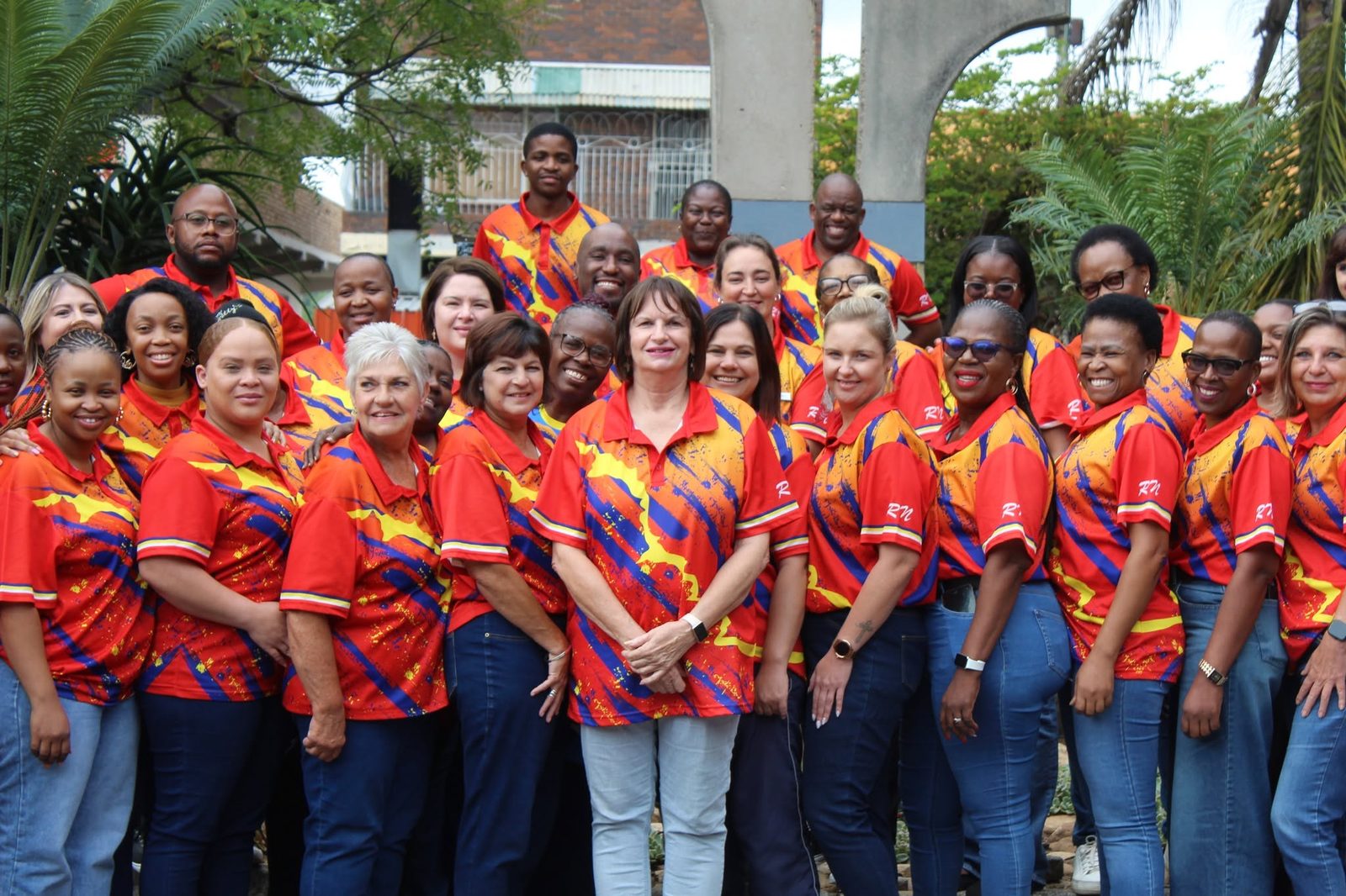 The Noord Primary staff team in matching school colours