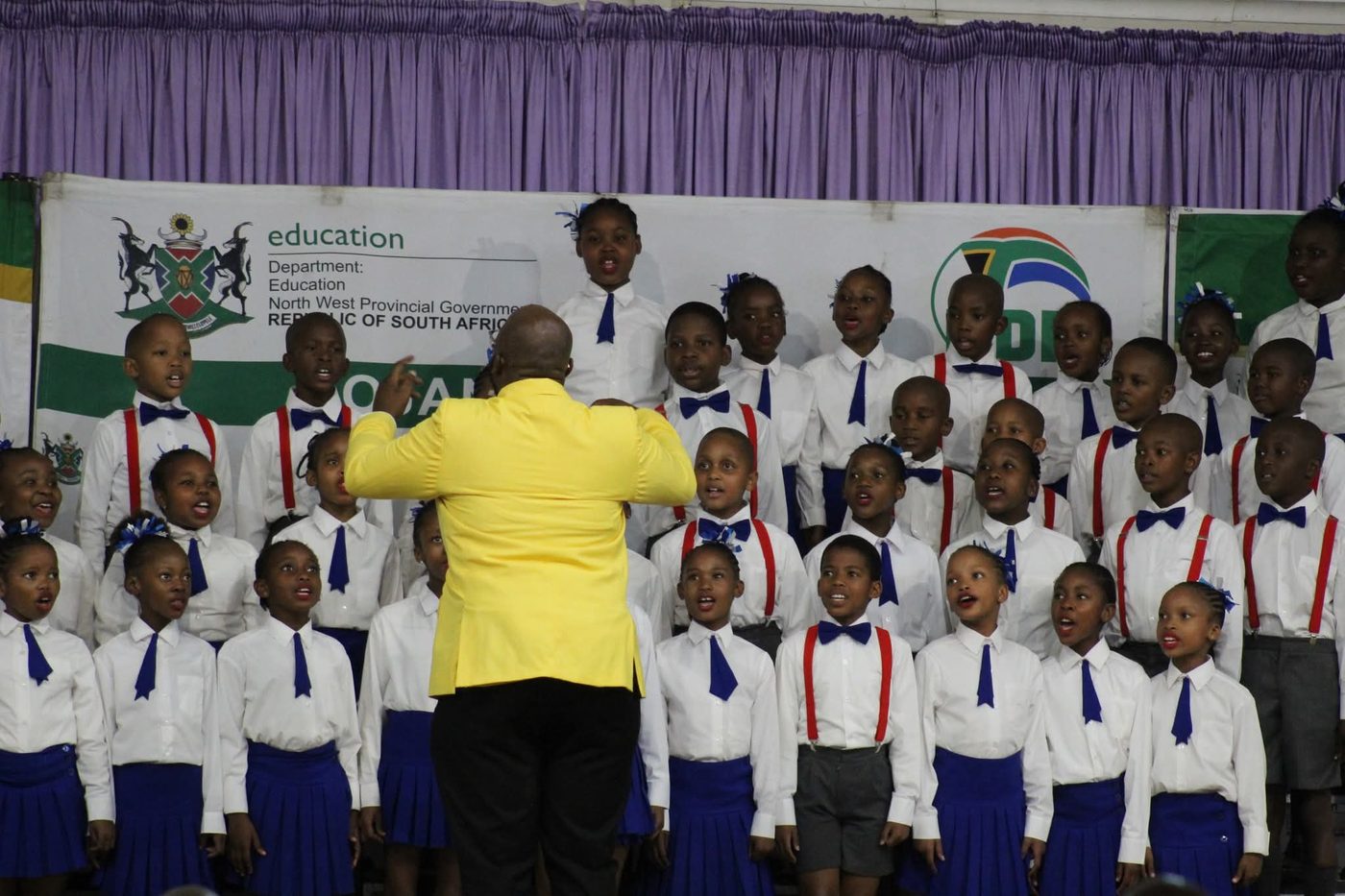 The Noord Primary choir in full song at a choir competition