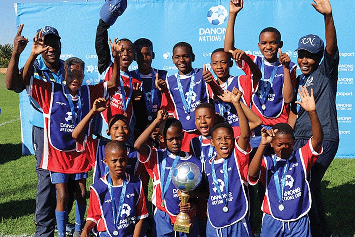 The Nories celebrating with the trophy at the Danone Nations Cup